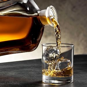 Personalized Argos Decanter by Home Wet Bar pouring liquor into a rocks glass