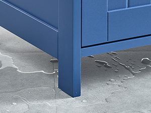 Close-up detail of blue furniture leg or base against gray flooring, showing construction detail at bottom corner.
