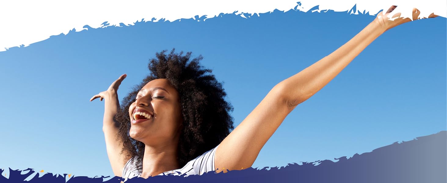 Woman outside, arms outstretched