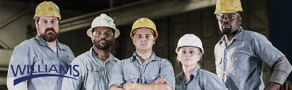 5 technicians standing in a row dressed for work in hard hats and safety glasses