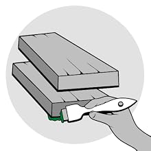 Image of person applying wood sealer on deck boards with a brush.