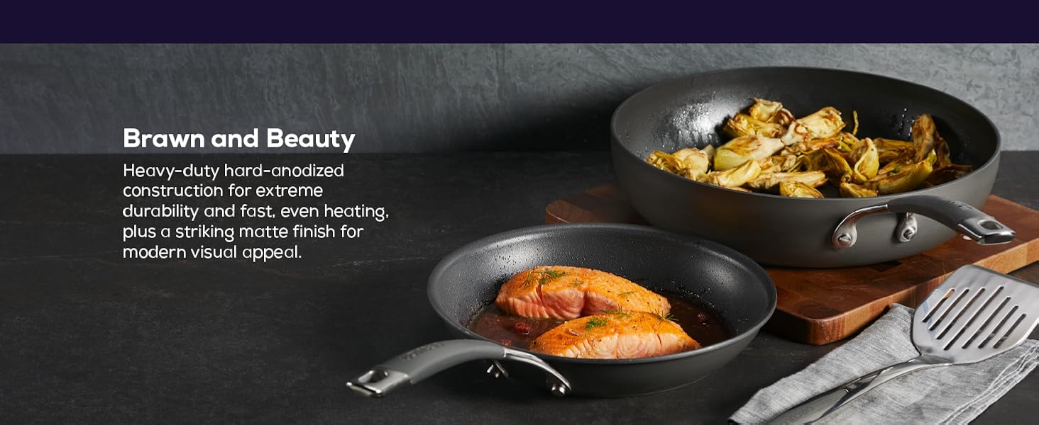 Eight inch skillet with salmon and a sute pan with sauted artichoke heart
