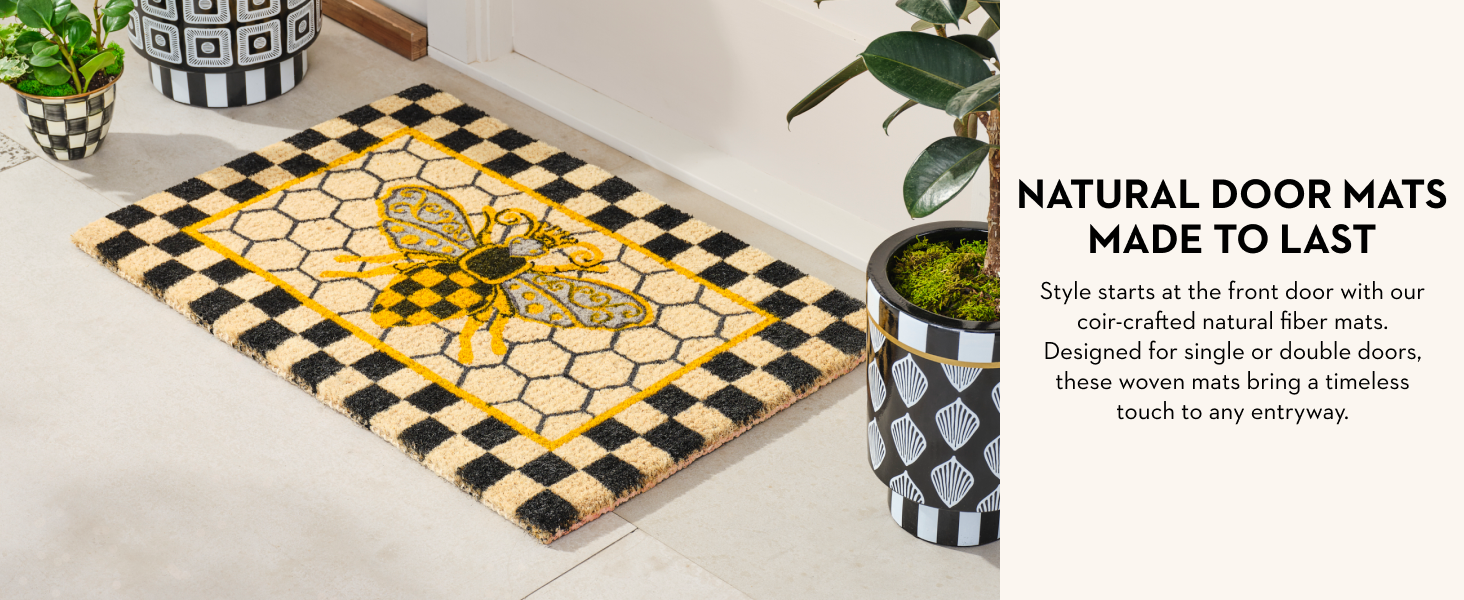 A Mackenzie-Childs coir doormat. Text reads: Natural mats made to last.