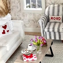 a living room with a couch, coffee table, and a chair.
