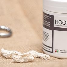 Text reads 'HOOF-STUFF'. Multiple views of white cosmetic-style jars with black text labeling, shown against a beige textured background.