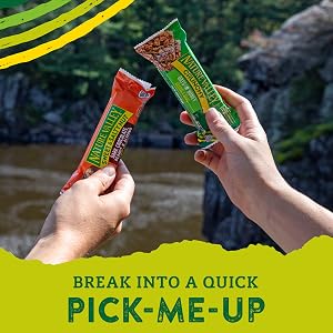 Two people holding up Nature Valley granola bars and the words break into a quick pick-me-up