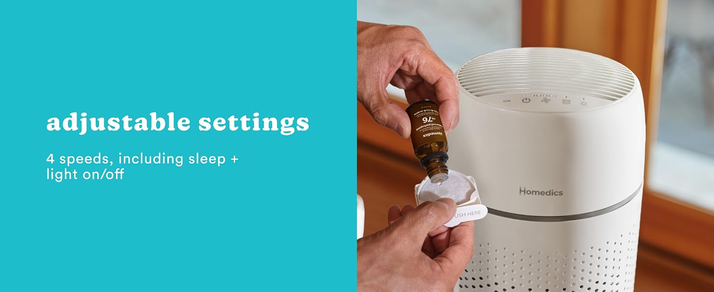 person adding essential oil into essential oil tray in white air purifier