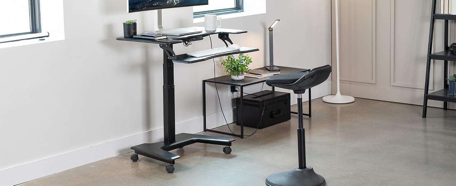 Mobile desk against wall with pedestal chair