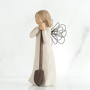 Angel of the Garden figure, leaning on a shovel, angle right