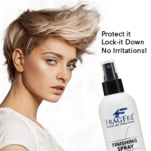 White girl with extreme hair style posing with a bottle of fragfre firm hold hair finishing spray