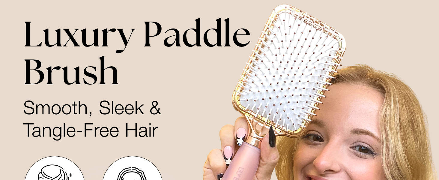 Text reads: 'Luxury Paddle brush' and 'Smooth, Sleek &amp; Tangle-Free Hair'. Product demonstration showing white paddle brush with dotted bristle pattern.