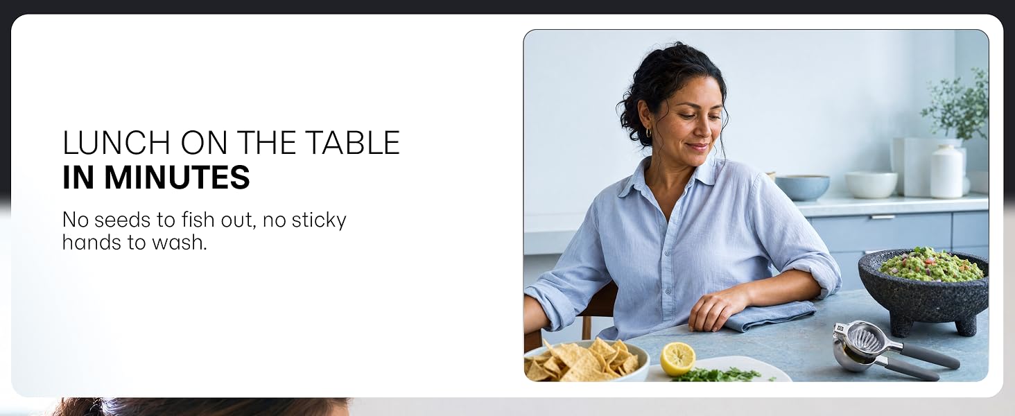 A stainless steel lime squeezer rests on the table beside a bowl of freshly made guacamole.