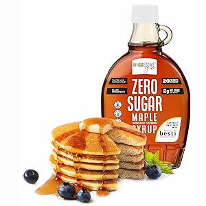 Wholesome Yum sugar free syrup next to pancakes
