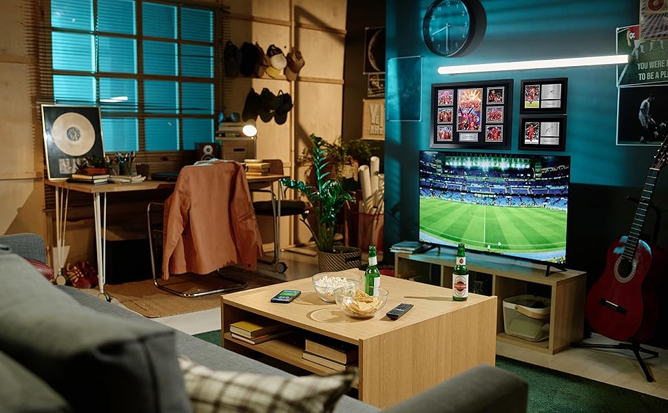 Series of gaming or entertainment room setups showing large displays mounted on walls with ambient lighting and gaming equipment visible.