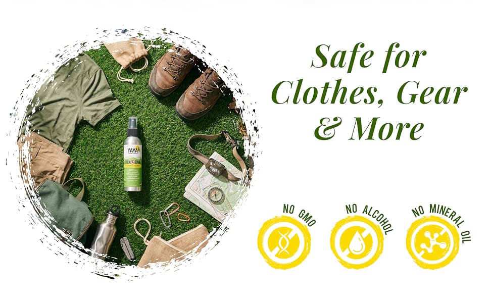 Tick Ban DEET-free bug spray on grass next to hiking clothes, boots, and gear