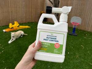 Wondercide Outdoor Pest Control with dog and toys in the yard