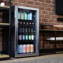 A Beverage Cooler Beside a TV in a Man Cave