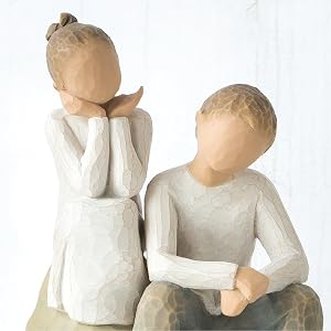 Close up detail of boy and girl figures.