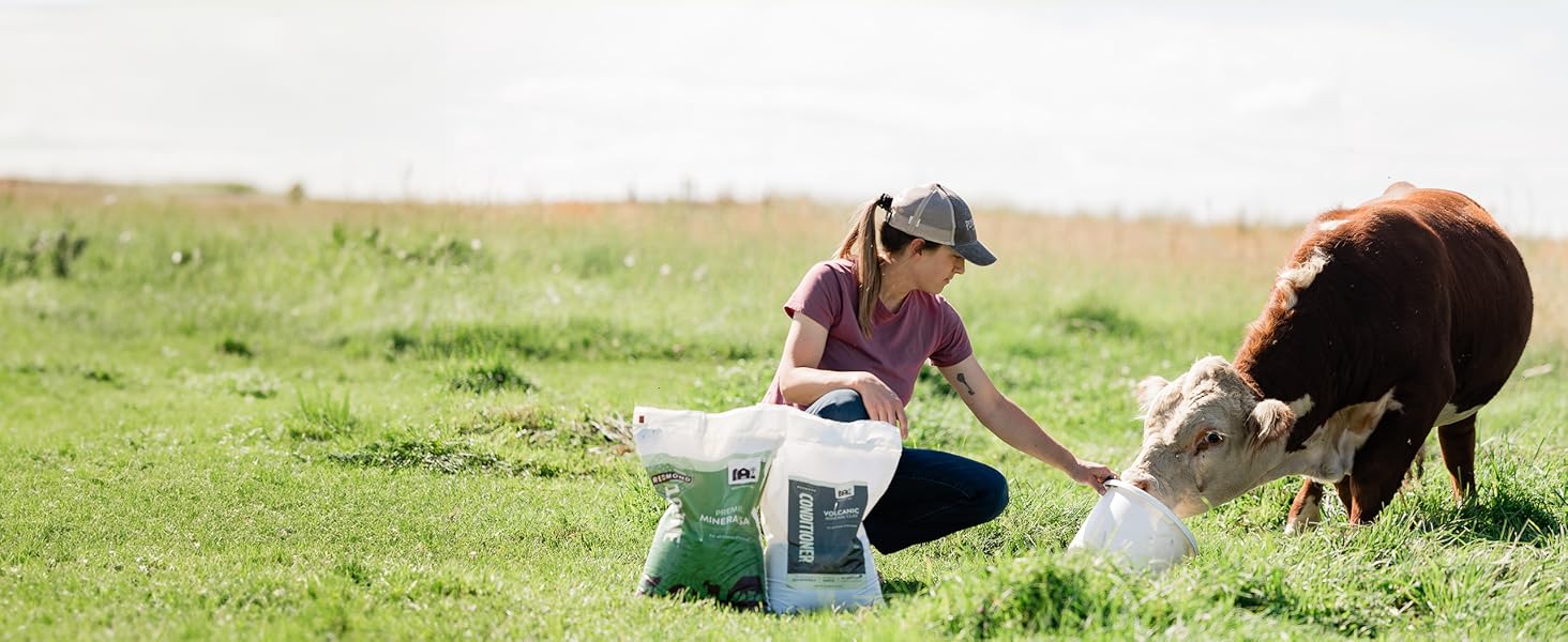 Farmer and child mixing Re-Lyte from ATV while checking on cattle