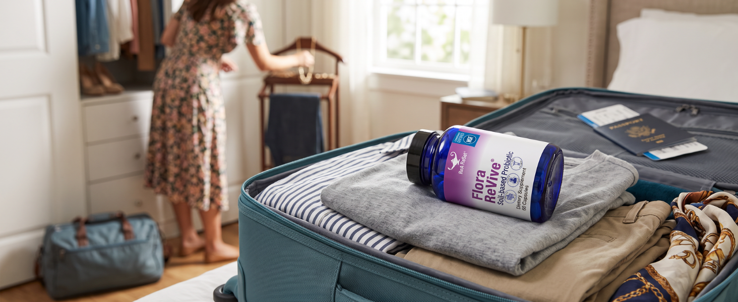 Flora Revive in a womans suit case as she packs for a trip