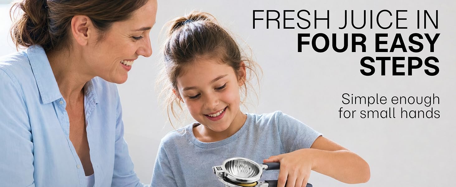A mother and her daughter squeeze a lemon together with a large manual citrus juicer.