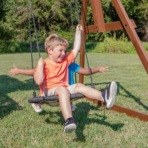 Backyard Discovery Skyfort All Cedar Swing Set, Elevated Covered Wood Roof Clubhouse with Bay Windows, 2 Belt Swings, Web Swing, 10ft Wave Slide