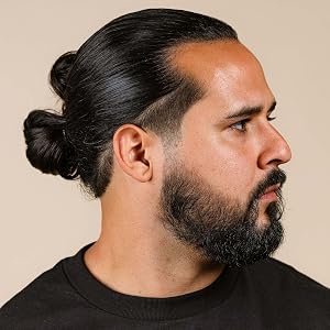 Man with long hair styled with Suavecito Hair Cream