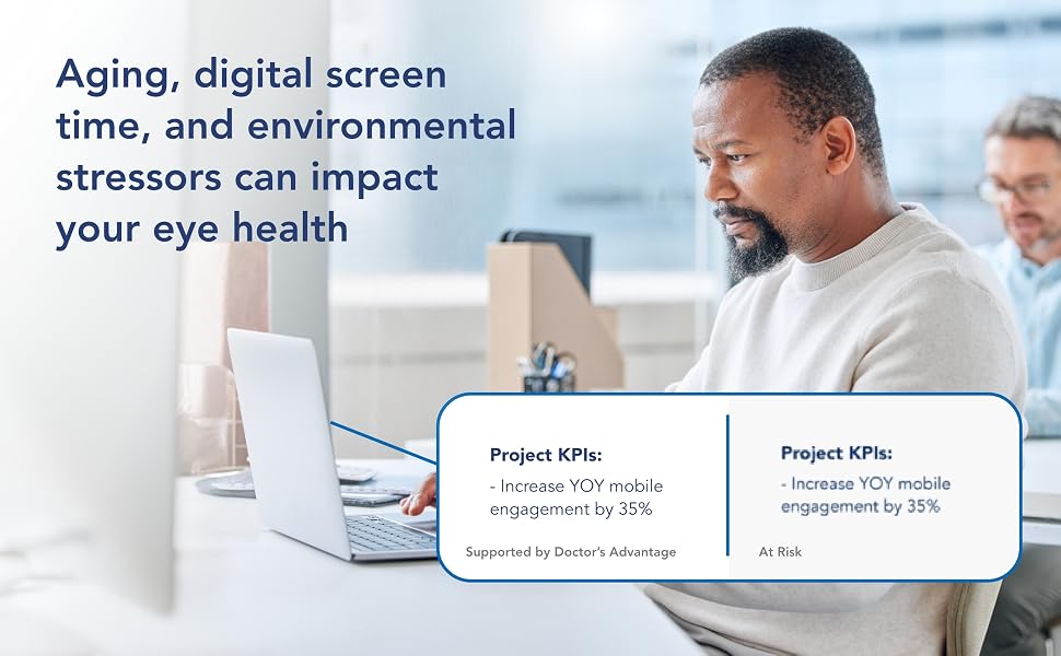 Mature man working in office on laptop with comparision of clear vs. blurry text.