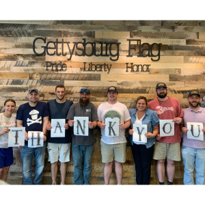 gettysburg flag team holding thank you sign