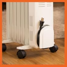 compact zone portable space heater has a built in cord storage area