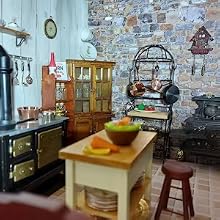 a small kitchen with a wooden table and a stove.