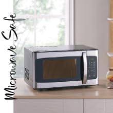 Microwave on counter in front of window