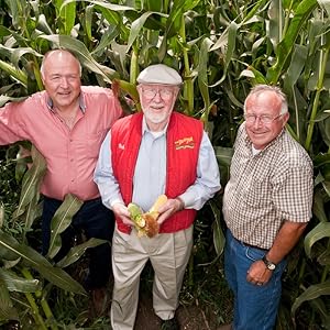 Bob Moore found of Bobs Red Mill in a field with farmers