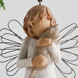 With affection ornament, detail of angel holding small cat