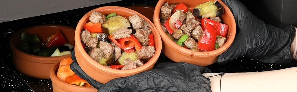 Mexican clay cookware set with terracotta pots, bowls and serving dishes for diverse cuisines.
