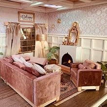 a living room with a couch, a fireplace and a mirror.