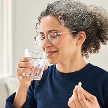 Woman about to take capsul pill