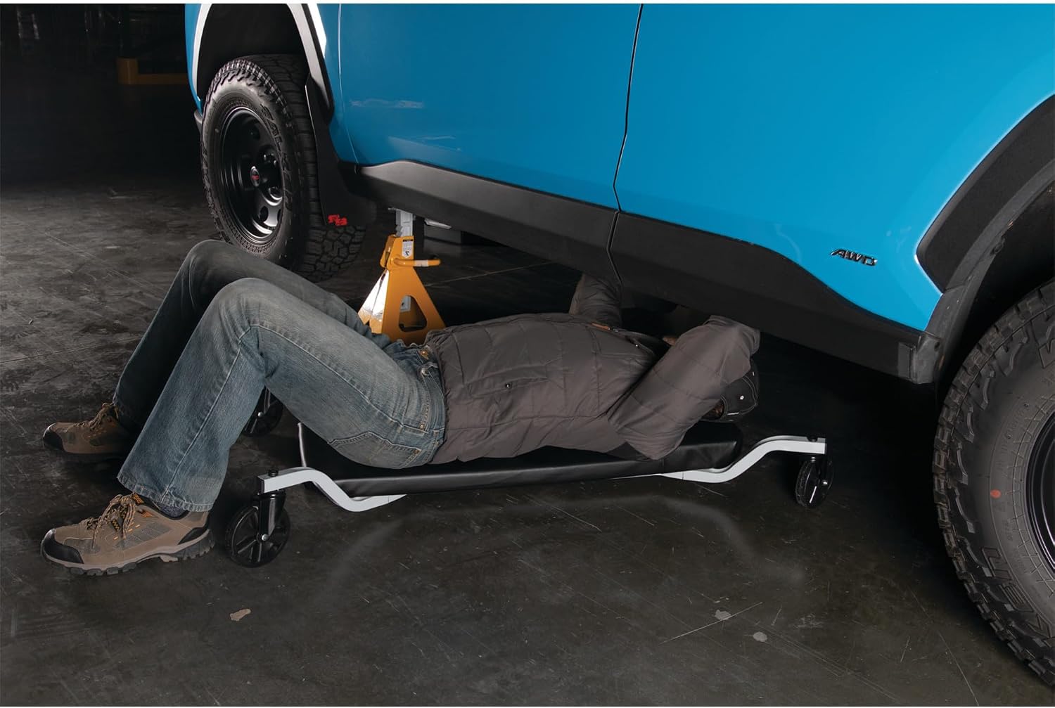 Performance Tool W85014 38 in. Low-Profile Automotive Mechanics Creeper | Oversized x-frame low profile creeper with 2-inch extra cushion padding. 5-inch jumbo swivel casters. 300 lb. capacity