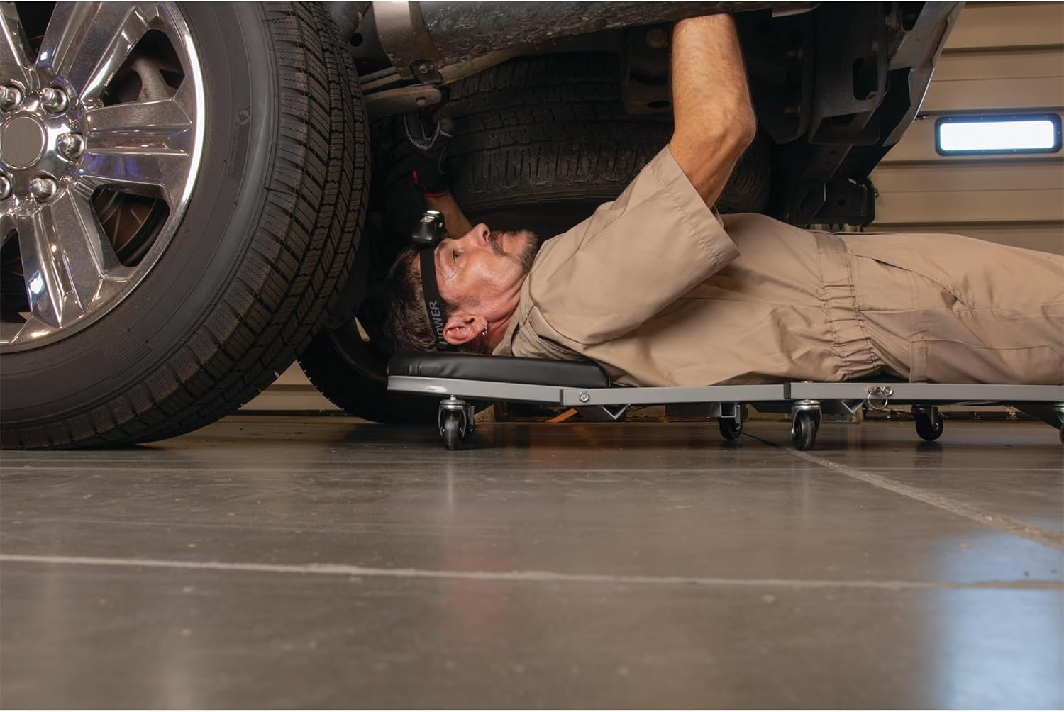 Performance Tool W85014 38 in. Low-Profile Automotive Mechanics Creeper | Oversized x-frame low profile creeper with 2-inch extra cushion padding. 5-inch jumbo swivel casters. 300 lb. capacity