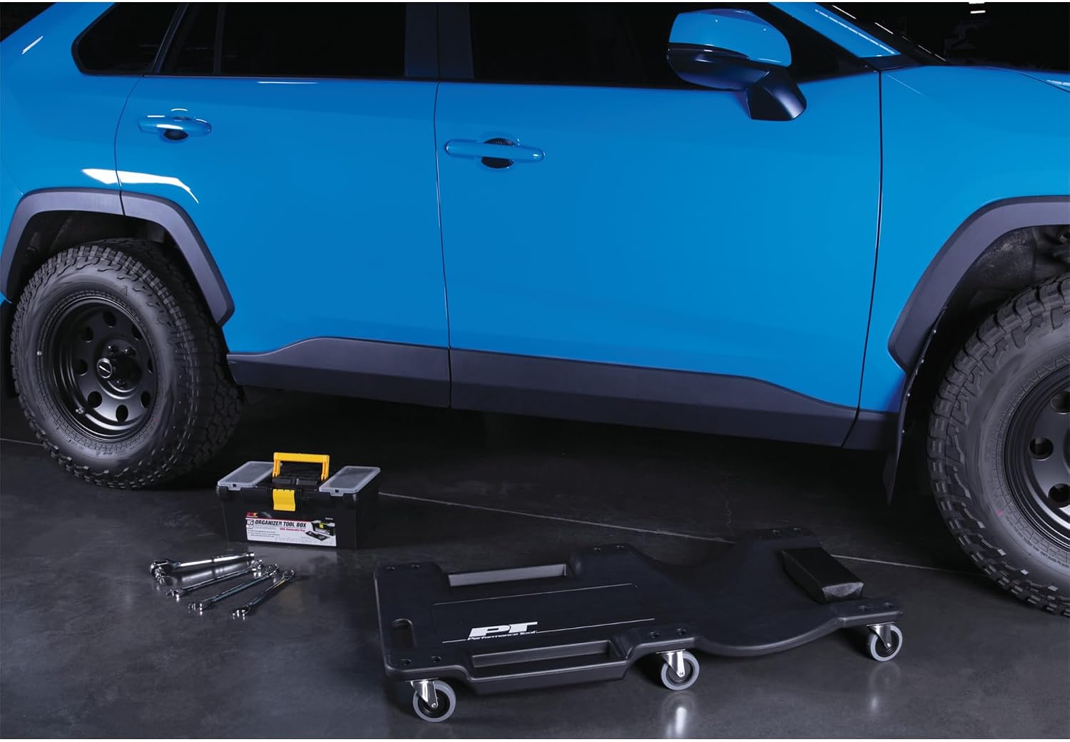 Performance Tool W85014 38 in. Low-Profile Automotive Mechanics Creeper | Oversized x-frame low profile creeper with 2-inch extra cushion padding. 5-inch jumbo swivel casters. 300 lb. capacity