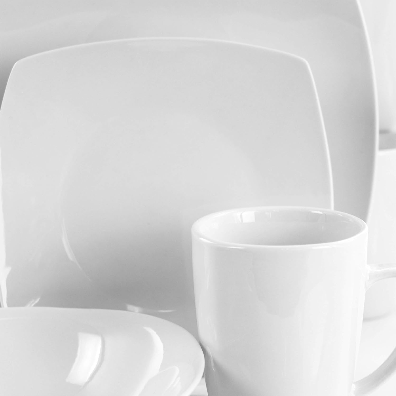 Elama Cara 16 Piece Round Porcelain Dinnerware Set in White