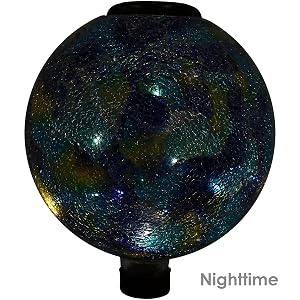 gazing globe lit up at night