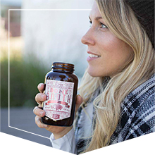Woman enjoying an EPIC bone broth beverage while on the go