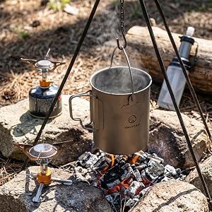 bail handle holding pot boiling water over fire