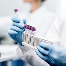 Close up of scientist holding test tubes