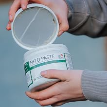 Series of images showing hands manipulating a clear plastic container or bottle against an outdoor background.