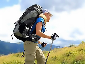 Girl hiking and playing music with Avantree Cyclone speaker.