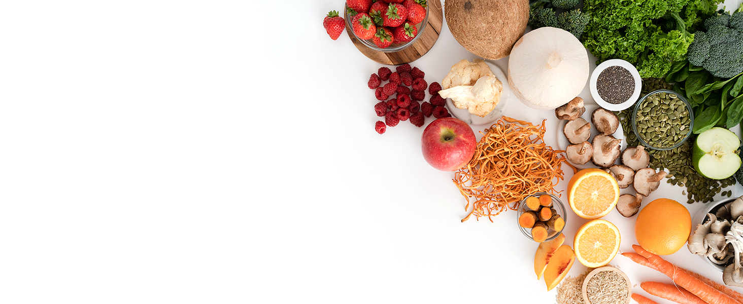 Top down view of a variety of delicious vegan ingredients layed flat on a white background