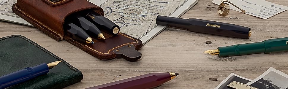 a collection of pens, notebooks, and pens.