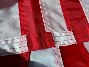 Reinforced fly end with multi-row stitching on American flag.